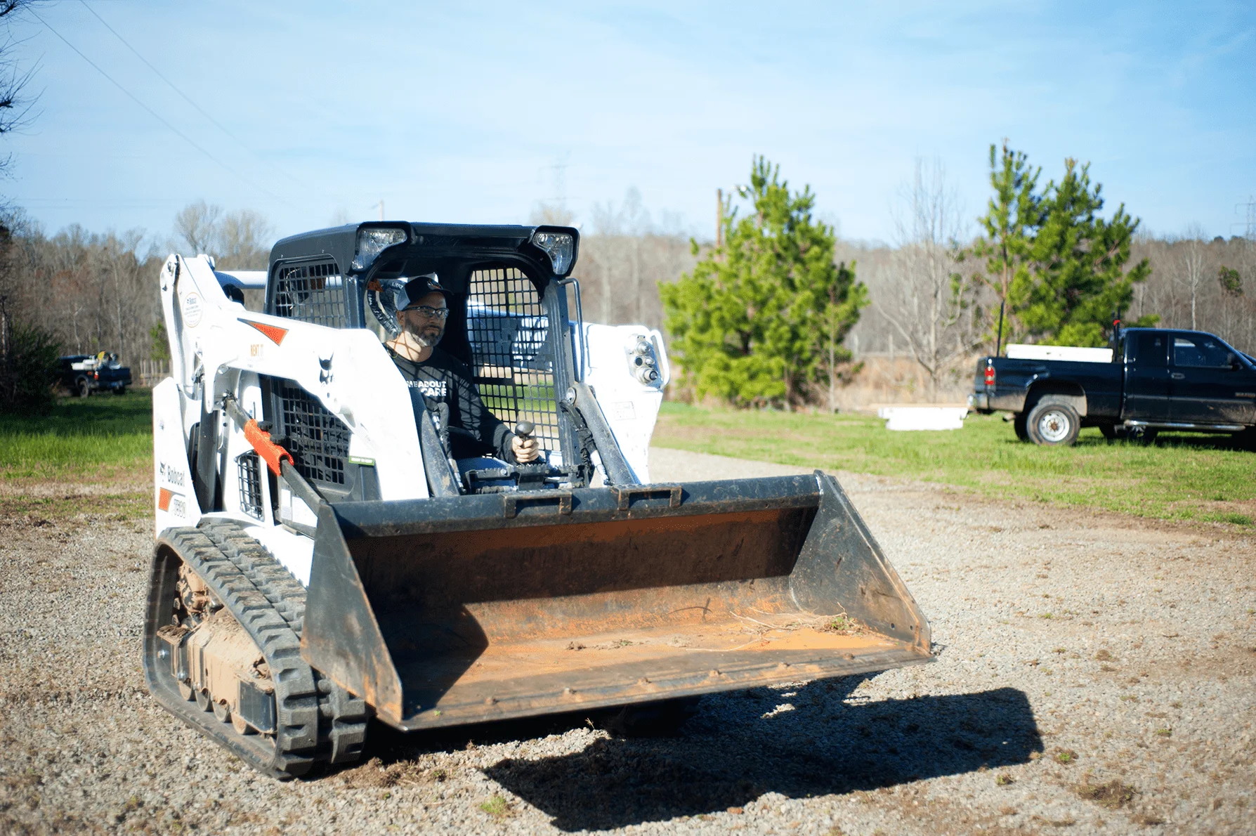 Skid steer with grapple attachment for demolition work