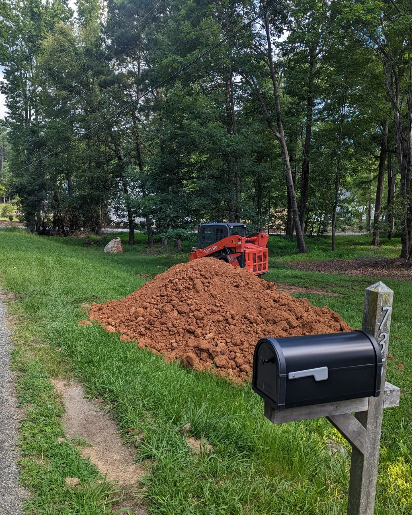 Uneven yard with poor drainage before grading